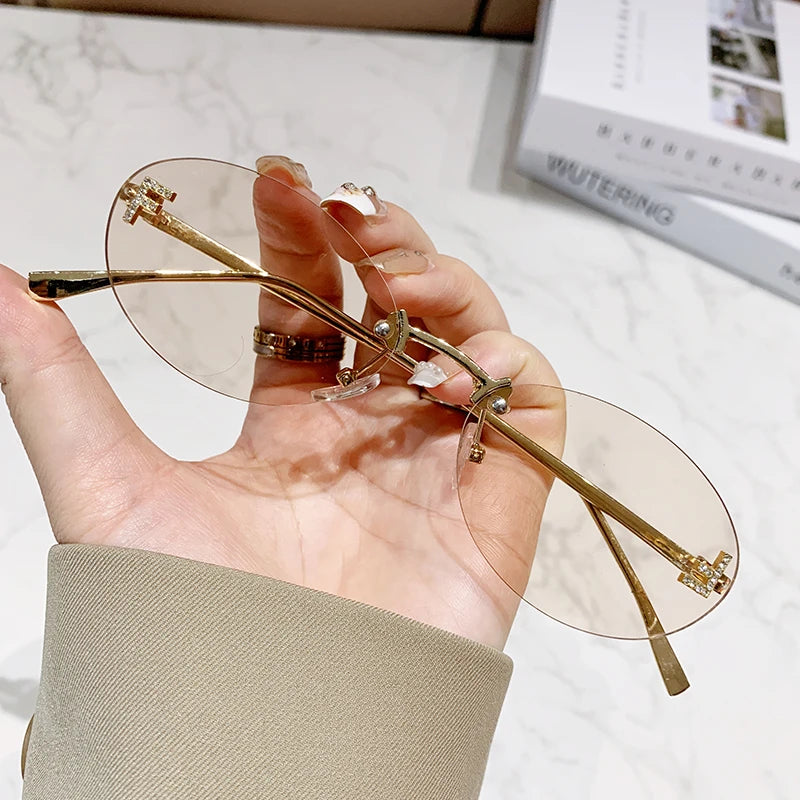 Protective Glasses Fashion Oval Rimless Design Sunglasses Female Small Size Metal Suneyeglass Outdoors Casual Vacation UV400